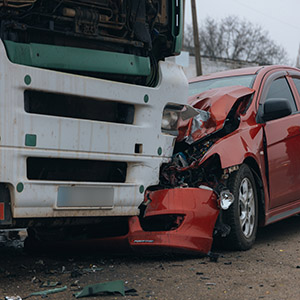   Car severely damaged after a collision with a semi-truck - Truck Accidents – Uninsured Motorists.